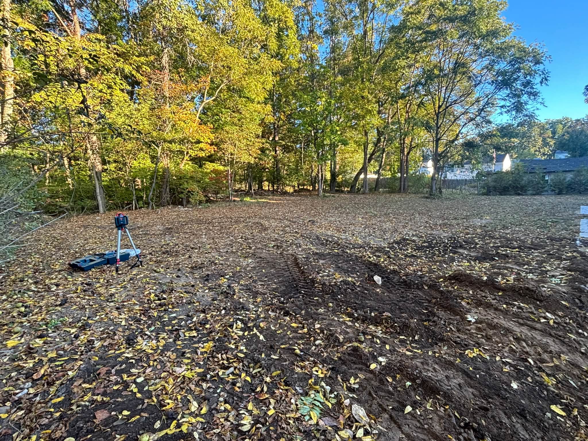 Backyard before excavation — grade issue from previous contractor